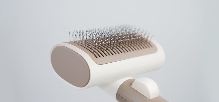 2-in-1 Pet Brush Kit with interchangeable heads for tangle and fur removal, pop-out function for easy cleaning and enhancing coat lustre.